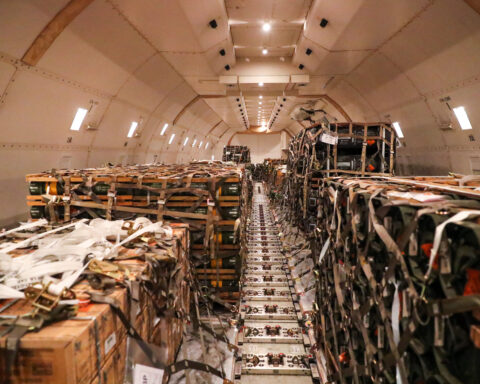 a large group of boxes in a cargo plane