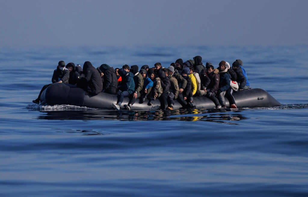 a group of people on a raft in the water