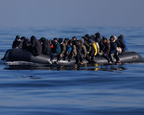 a group of people on a raft in the water